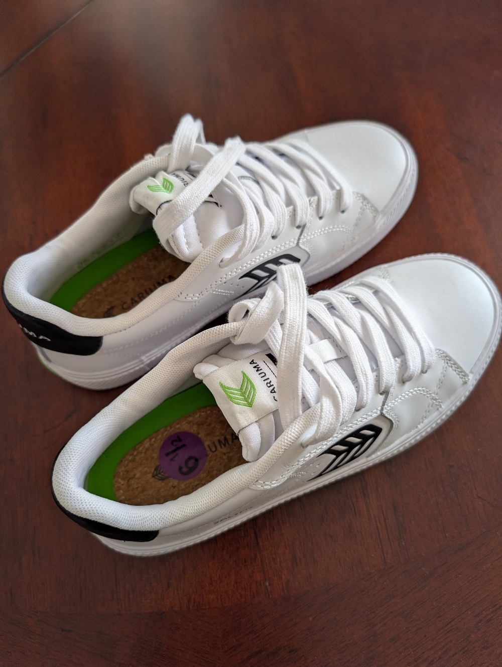 White Cariuma Low-Top Sneakers with Green Accents